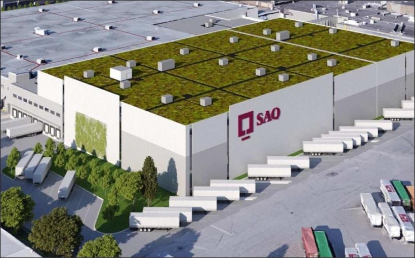 SAQ) has suspended its $300-million Montreal distribution centre expansion amid concerns about possible unmarked graves at the site.