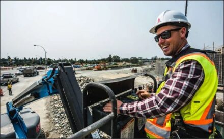 Photo of construction worker operating a machine.